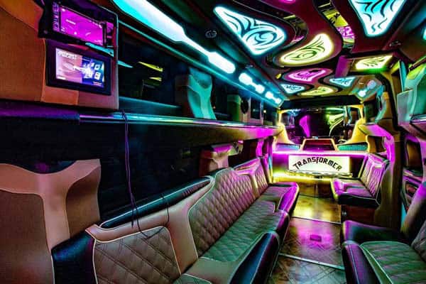 Neon-lit luxury limousine interior with leather seating
