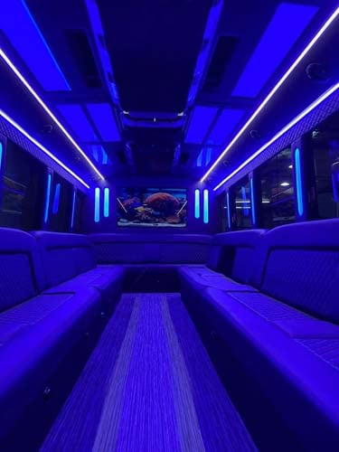 Blue neon-lit luxury limousine interior with leather seats