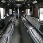 Luxury bus interior with black leather seating
