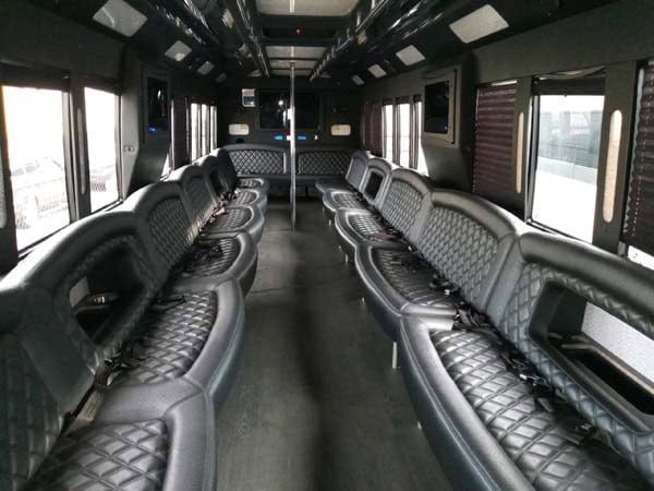 Luxury bus interior with black leather seating