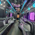 Luxury party bus interior with neon lights and leather seats