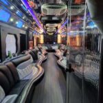 Luxury party bus interior with neon lights and seating