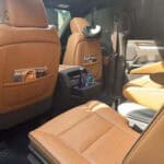 Luxury SUV interior with tan leather seats and sunroof