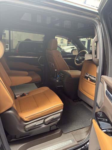 Tan leather interior of luxury SUV with captain seats