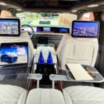 Luxury SUV rear cabin with screens and trays