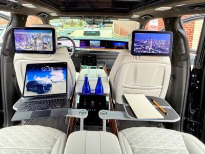 Luxury SUV rear cabin with screens and trays