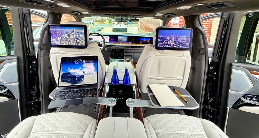Luxury SUV rear cabin with screens and trays