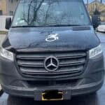 Front view of Mercedes van with wheelchair symbol.