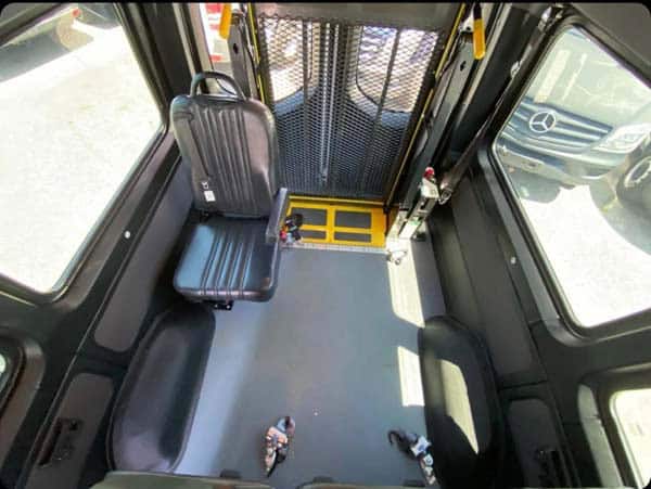 Wheelchair-accessible van interior with single seat and ramp