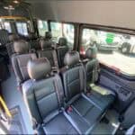 Interior of passenger van with black leather seats