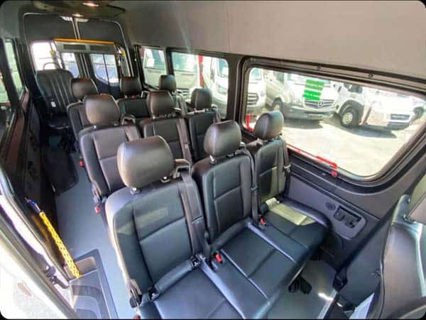 Interior of passenger van with black leather seats