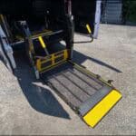 Wheelchair lift ramp extended from accessible van