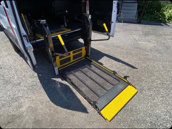 Wheelchair lift ramp extended from accessible van