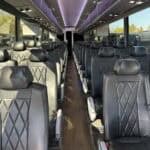 Interior of modern coach bus with black leather seats