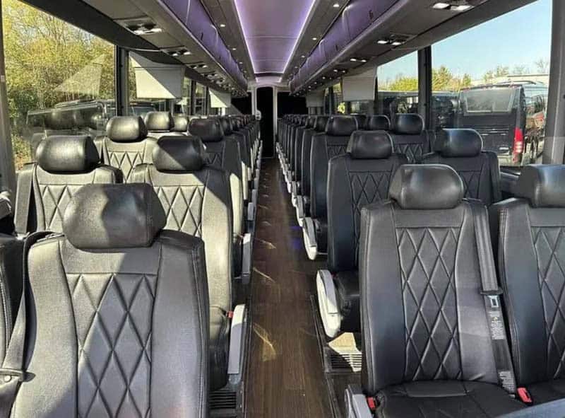 Interior of modern coach bus with black leather seats