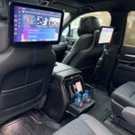 Luxury SUV rear cabin with headrest entertainment screens