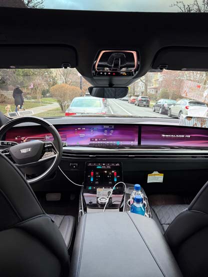 Cadillac Escalade interior with dashboard screens and street view
