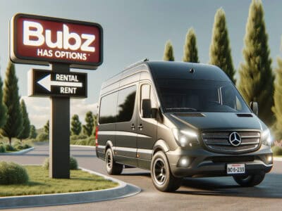 Mercedes van parked by rental sign outdoors