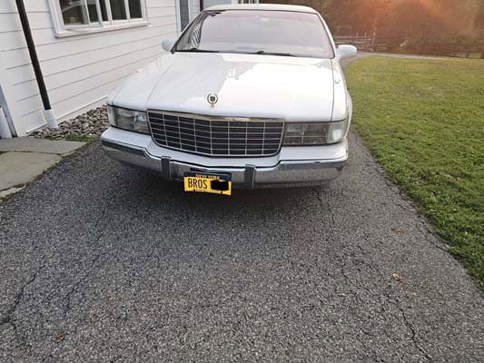 Front view of white vintage Cadillac sedan