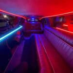 Neon-lit limousine interior with leather seating