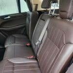 Brown leather car back seats with seatbelts