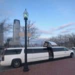 White stretch limousine parked on city street