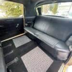 Vintage car interior with black rear bench seat