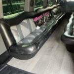 Luxury stretch limousine interior with black leather seating