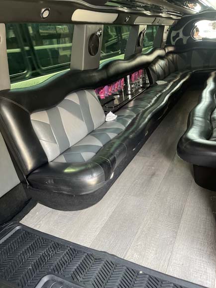 Luxury stretch limousine interior with black leather seating