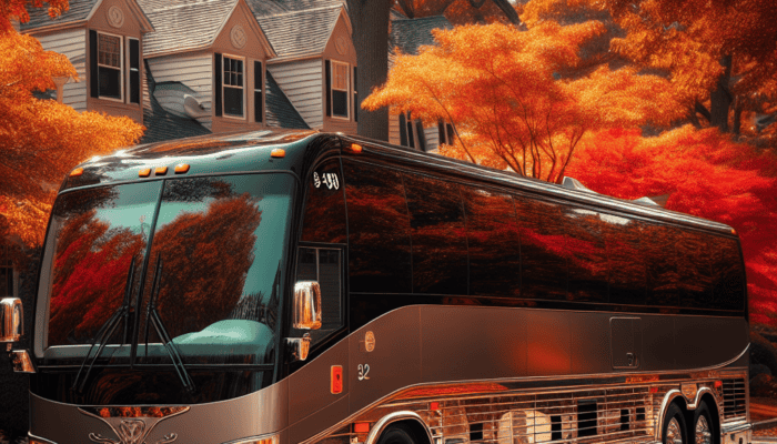Luxury tour bus parked on autumn suburban street