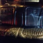 Black leather rear seats inside a vintage car