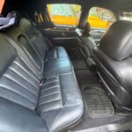 Black leather backseat interior of sedan