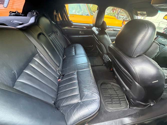 Black leather backseat interior of sedan