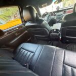 Black leather car interior with back seat view