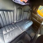 Black leather back seat of car interior