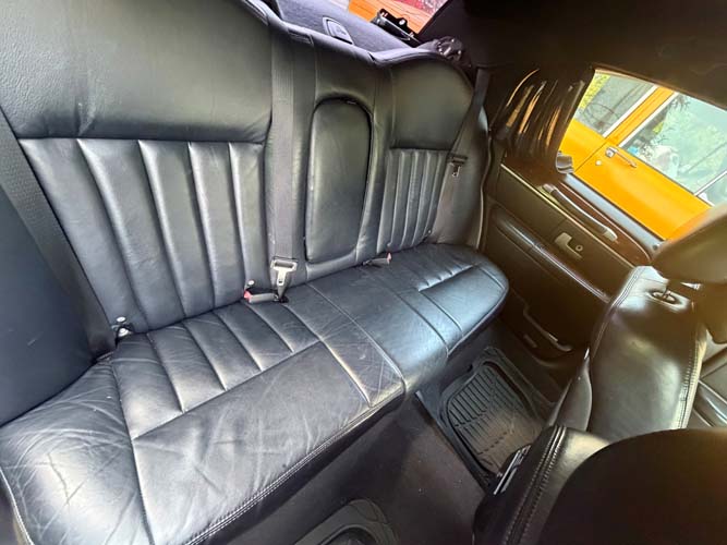 Black leather back seat of car interior
