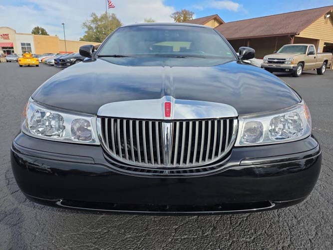 Front view of black Lincoln sedan in parking lot