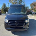 Front view of a black Mercedes-Benz Sprinter van.