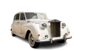 Vintage white luxury car with chrome grille and headlights