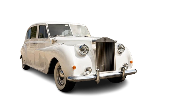 Vintage white luxury car with chrome grille and headlights