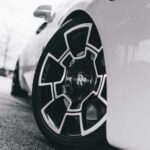 Close-up of a white Rolls-Royce wheel with geometric rim.