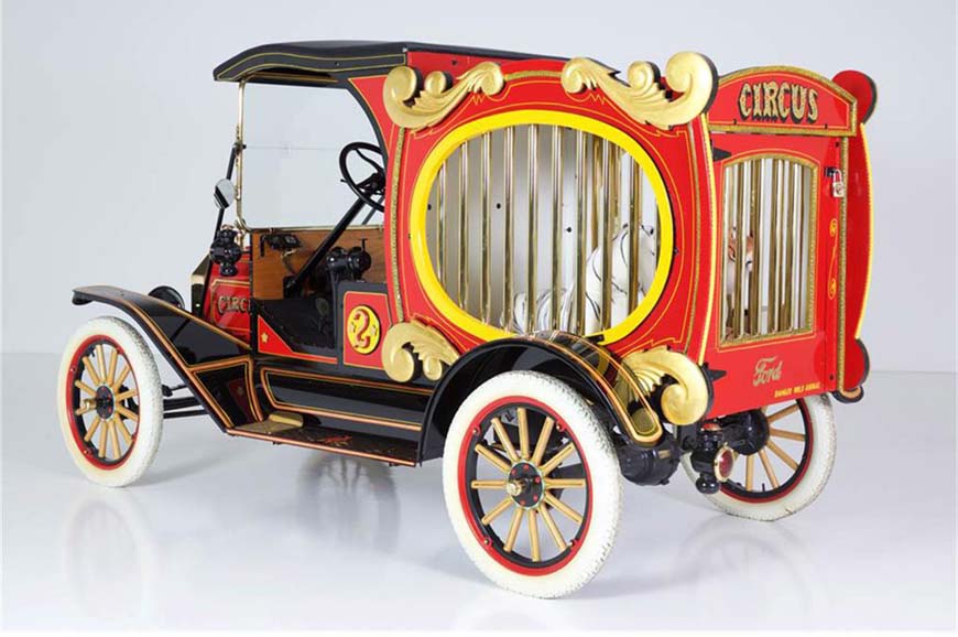 Vintage red and gold circus-themed Ford truck