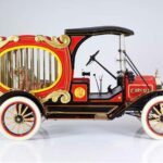 Vintage circus car with caged tiger inside