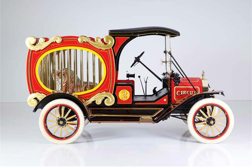 Vintage circus car with caged tiger inside