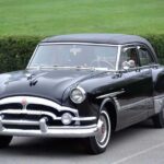 Black 1950s vintage classic car parked outdoors