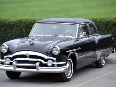Black 1950s vintage classic car parked outdoors