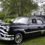 Black 1950s vintage sedan at outdoor car show