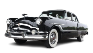 Black vintage 1950s sedan with whitewall tires