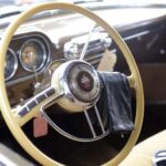 Vintage car interior with classic steering wheel and dashboard