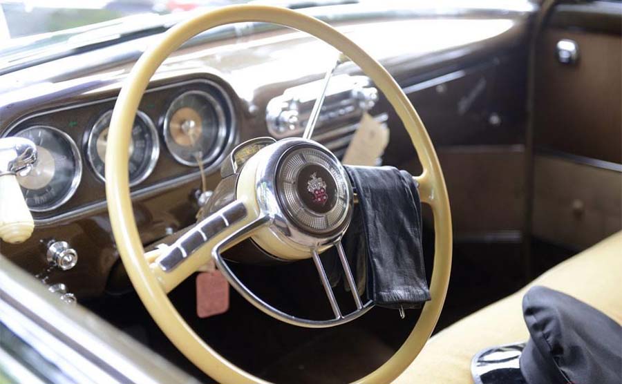 Vintage car interior with classic steering wheel and dashboard